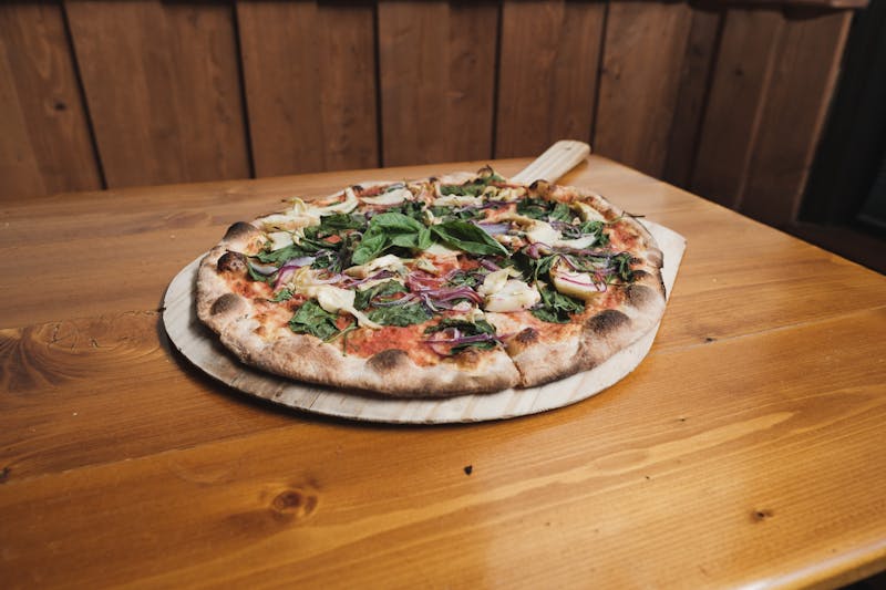 Gluten-free thin crust pizza custom build with fresh toppings