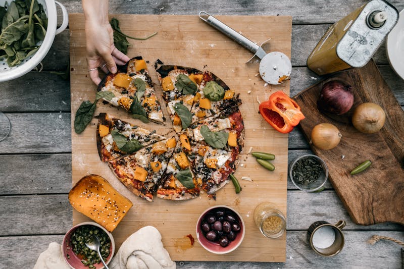 Cauliflower crust pizza with vegan cheese and roasted veggies