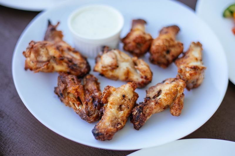 Crispy chicken strips with buffalo sauce and ranch dipping cups