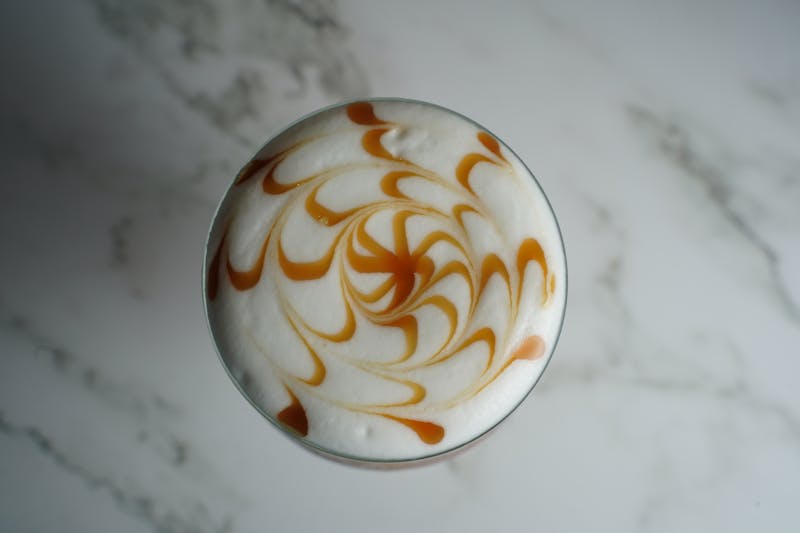Craft iced coffee with oat milk and caramel drizzle